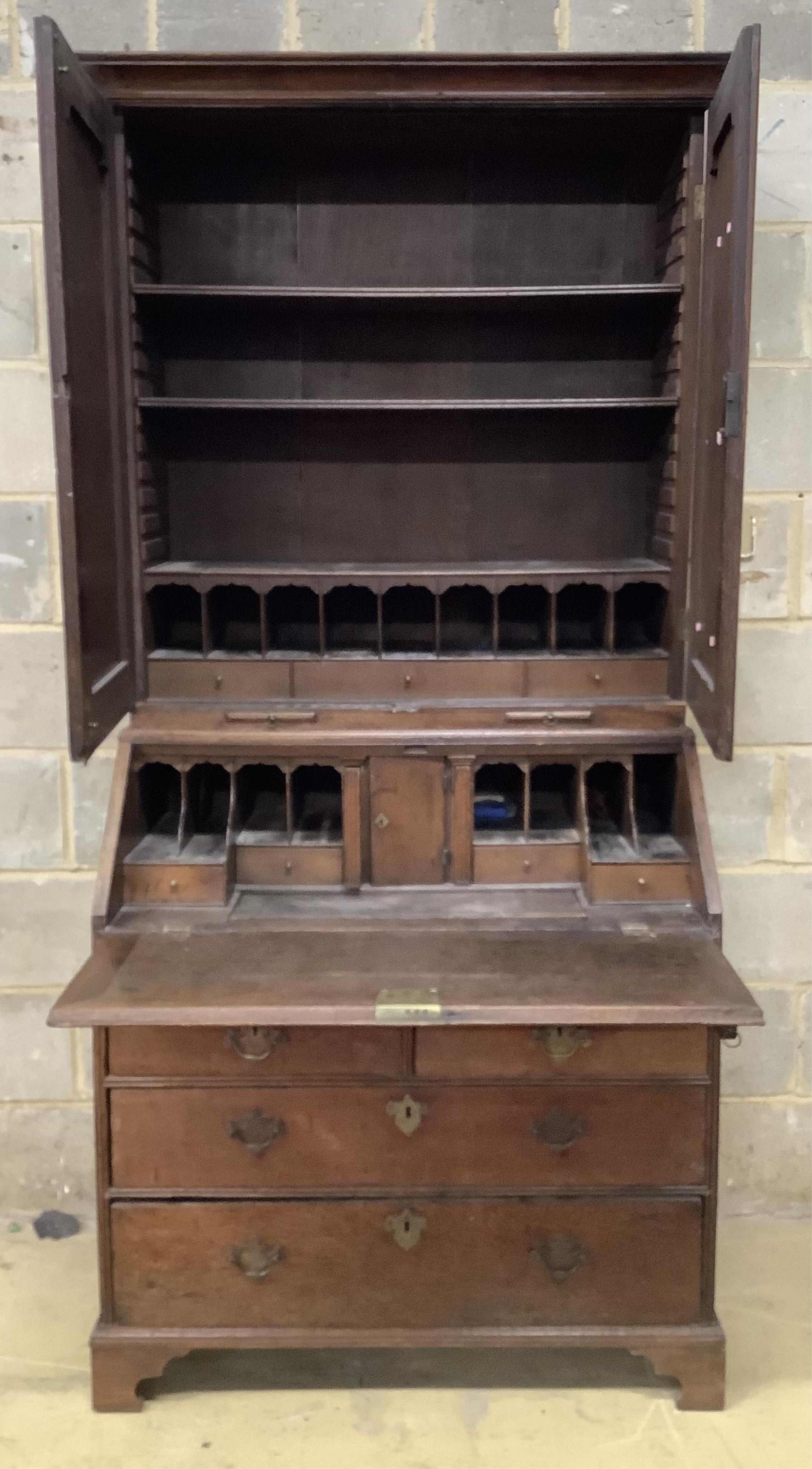 An early 18th century oak bureau cabinet, width 92cm, depth 54cm, height 199cm. Condition - fair
